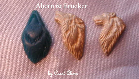 Wolf heads, wax and cast