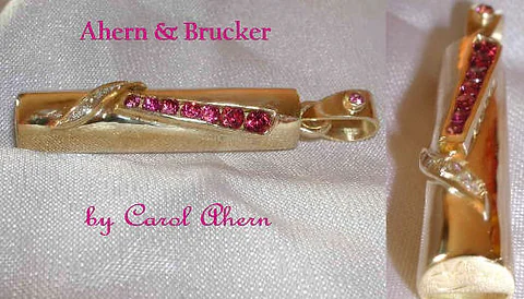 A Garnet and Diamond Whistle Pendant