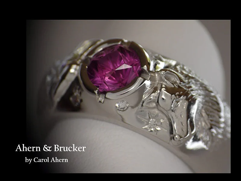 A Platinum and Pink Sapphire Wolf Engagement Ring