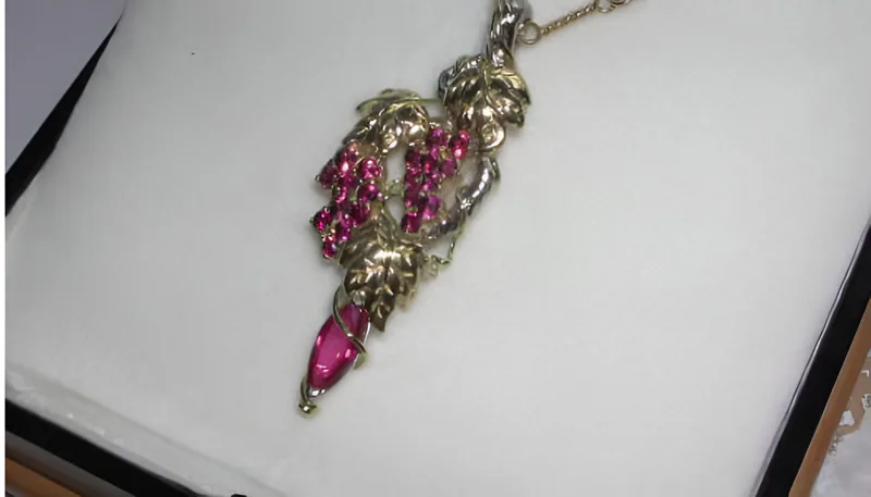 A Ruby and Garnet Grape Cluster Pendant